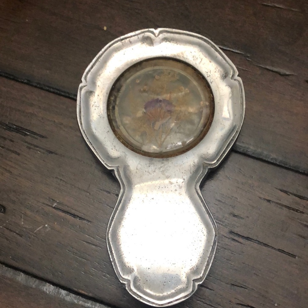 Stainless flower inside glass